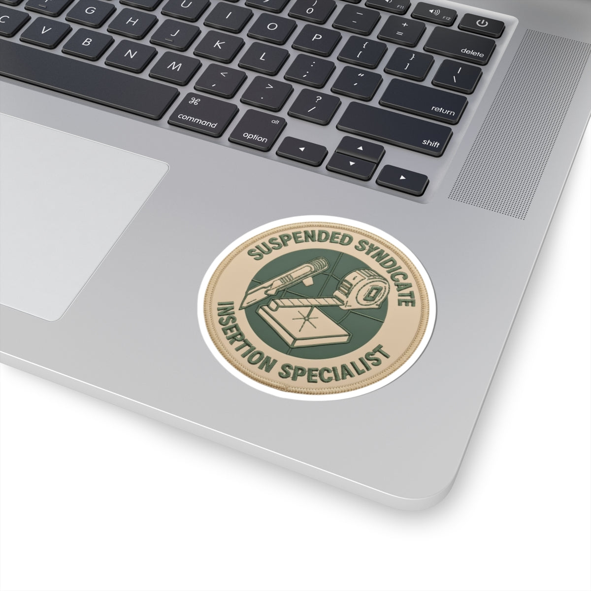 “Suspended Syndicate. Insertion Specialist” (light pvc patch version) kiss-cut sticker