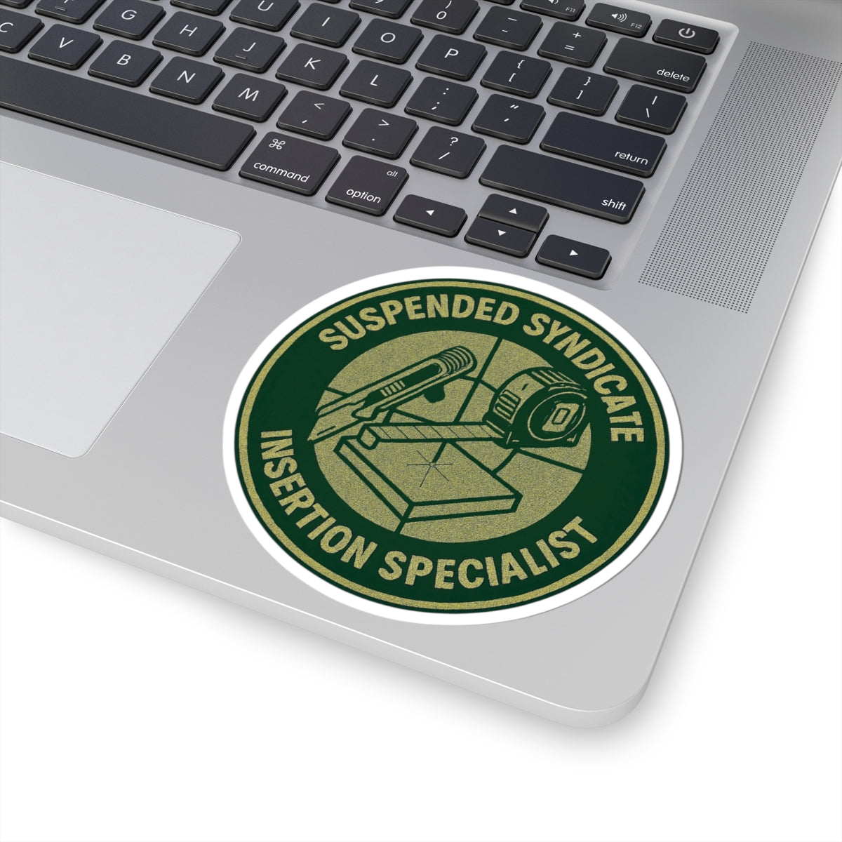 “Suspended Syndicate. Insertion Specialist” kiss-cut sticker