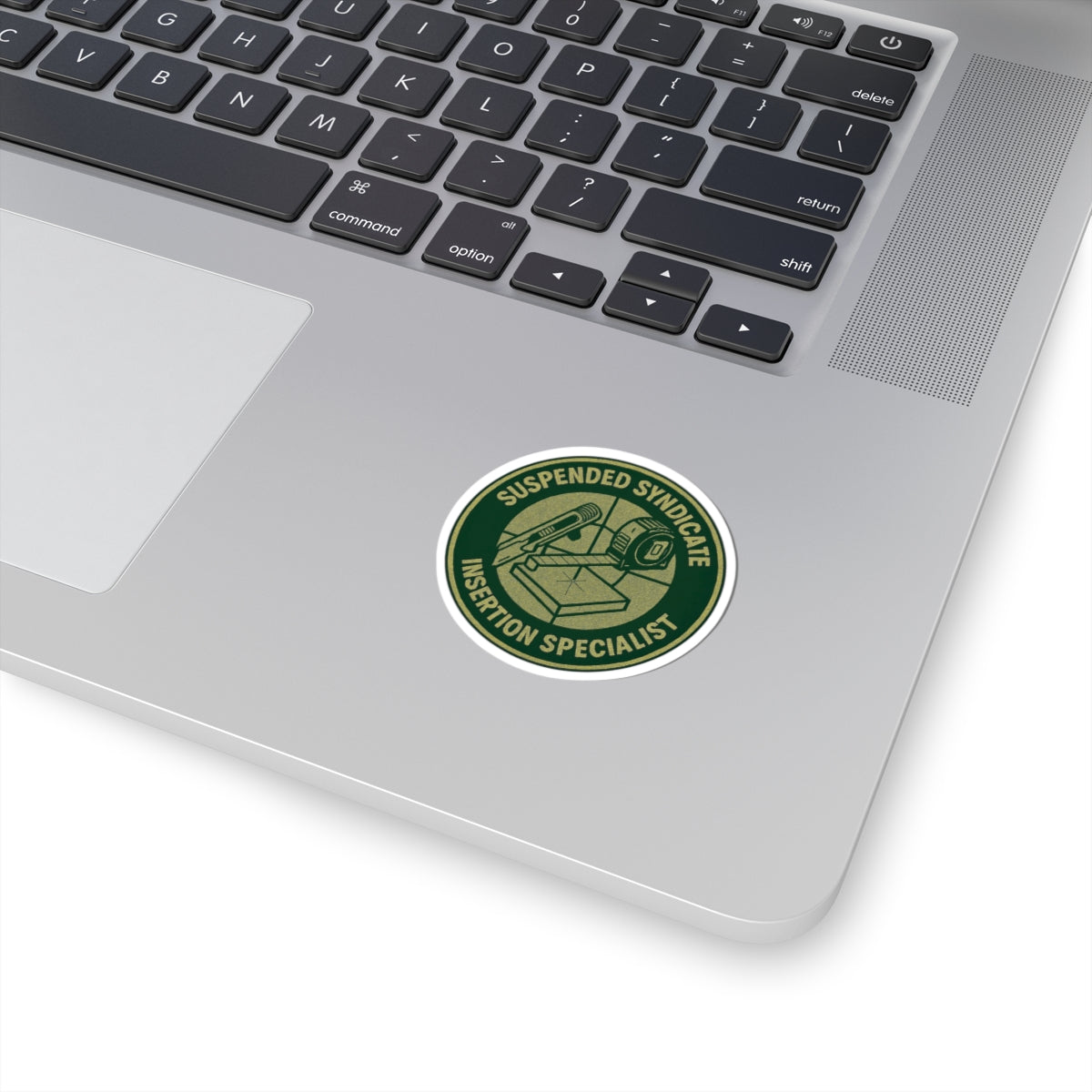 “Suspended Syndicate. Insertion Specialist” kiss-cut sticker