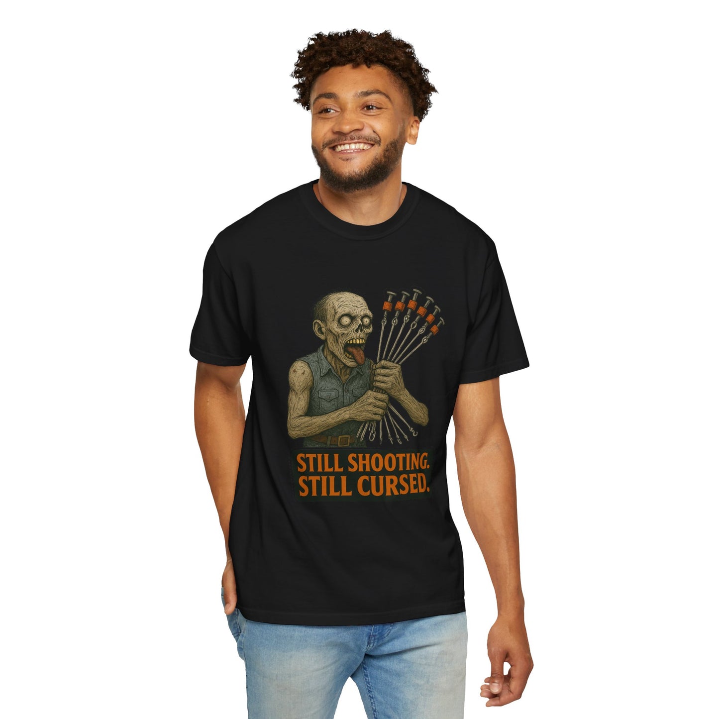 “Still Shooting. Still Cursed” (print on front) Zombie Ceiling Wire Shooter shirt